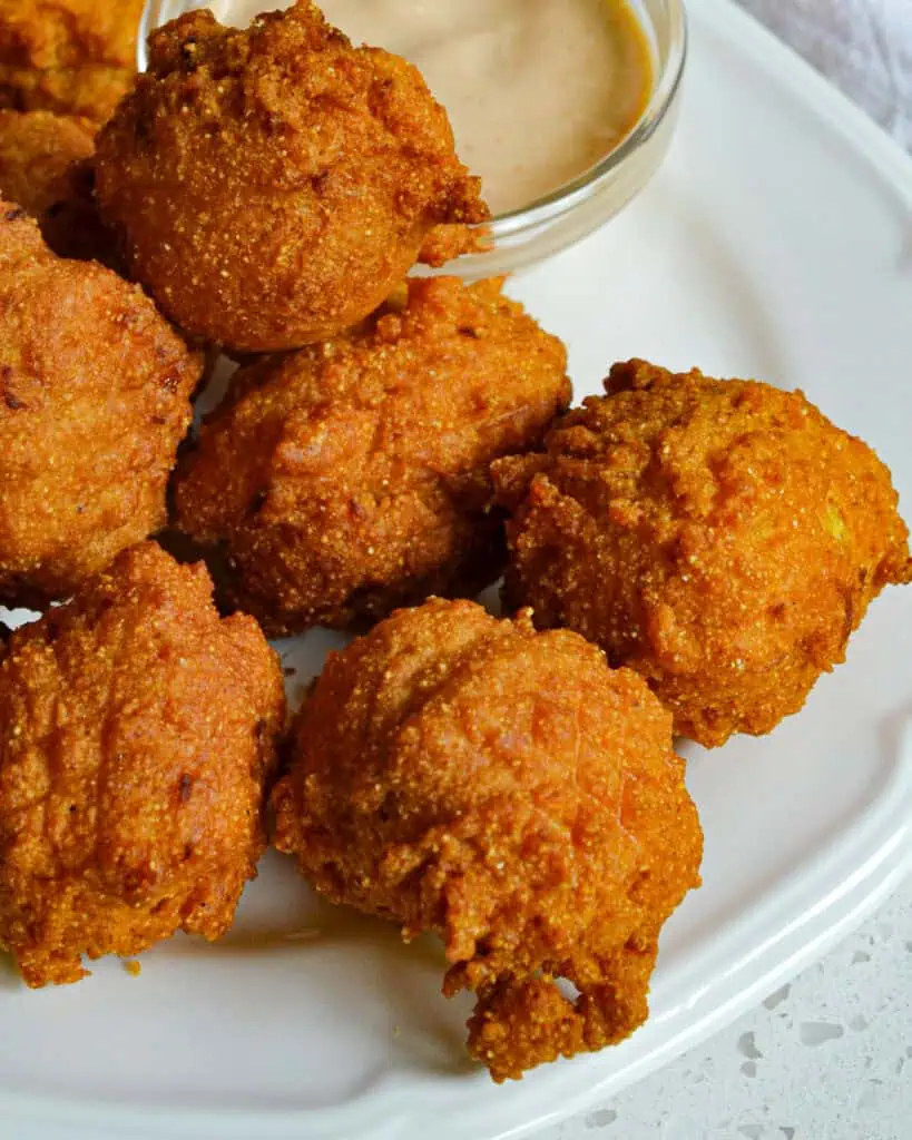 Fried dough balls with a spicy comeback sauce