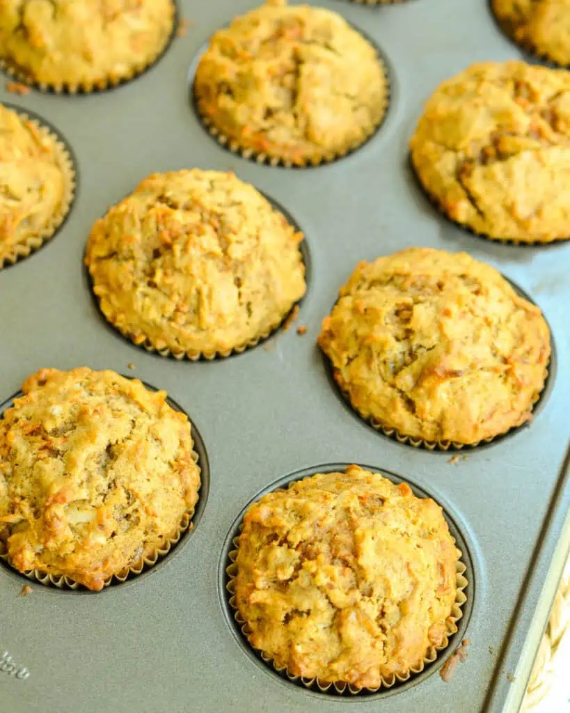 Fresh baked morning glory muffins in a tin. 