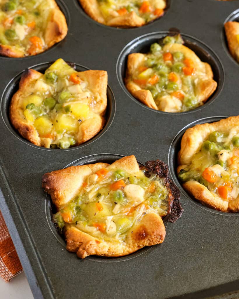 Mini Chicken Pot Pies in a muffin tin after baking.