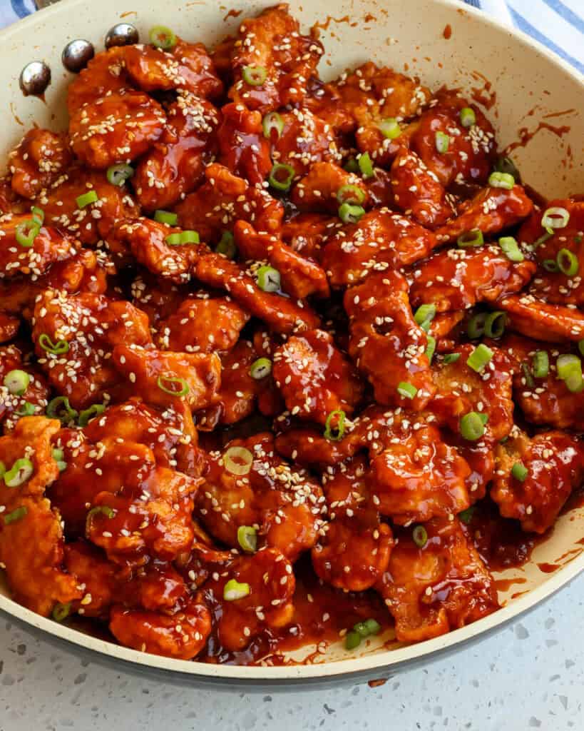 Scrumptious Sesame Chicken Recipe This easy Sesame Chicken Recipe combines pieces of battered crispy fried chicken with an easy eight-ingredient sauce that has both sweet and salty flavors with just a hint of spice.