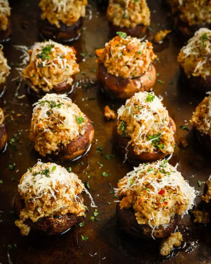 Sausage Cream Cheese Stuffed Mushrooms Sausage stuffed mushrooms on a baking sheet.