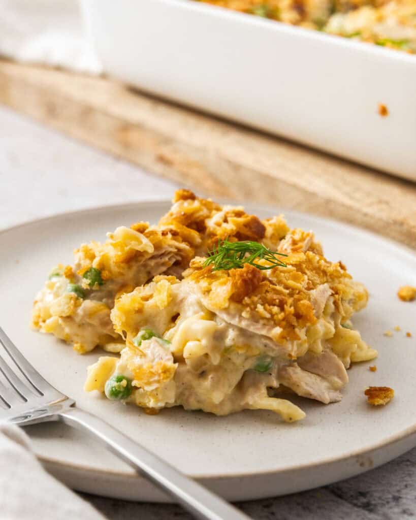 A single serving plate with tuna noodle casserole and a fork. 