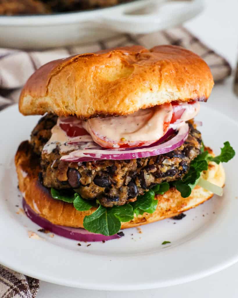 A black bean burger with lettuce, tomato, red onion, and chipotle mayo. 