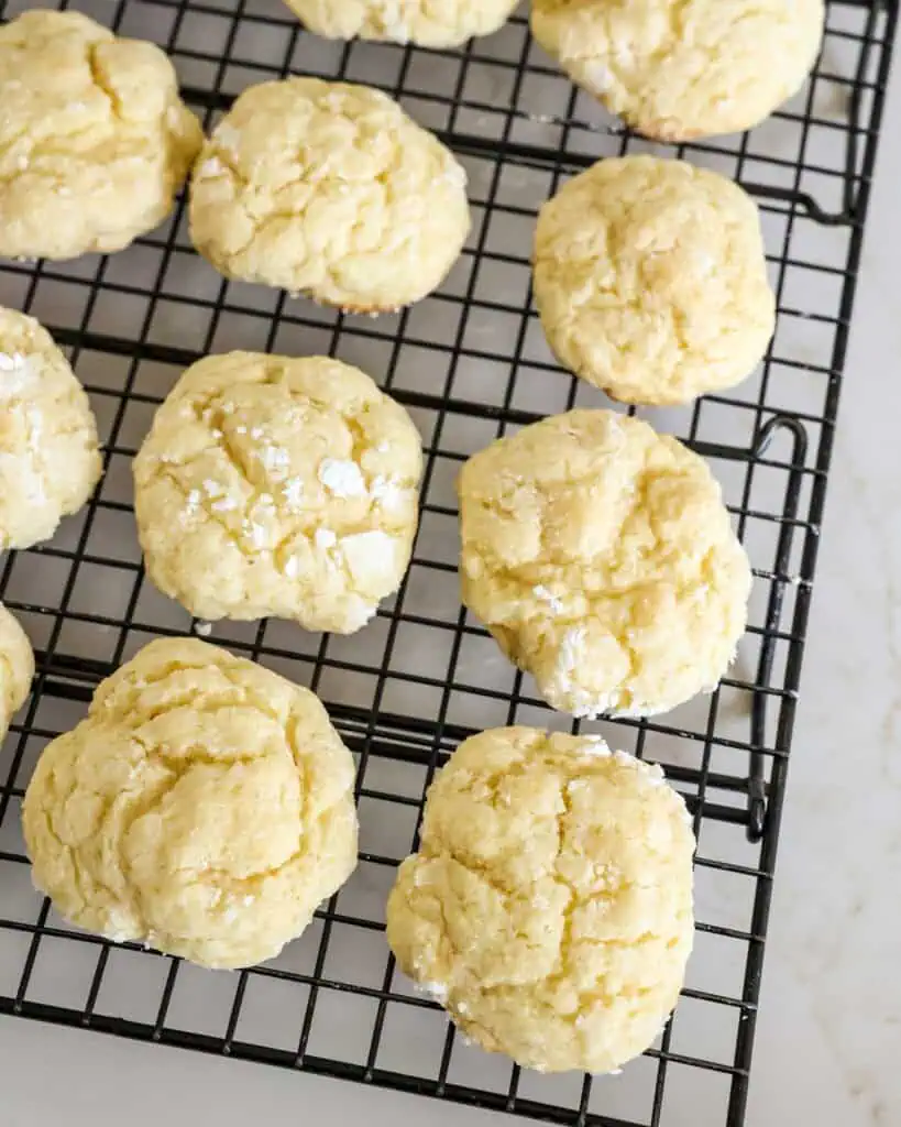 Gooey butter cookies cooling on a wire rack. 