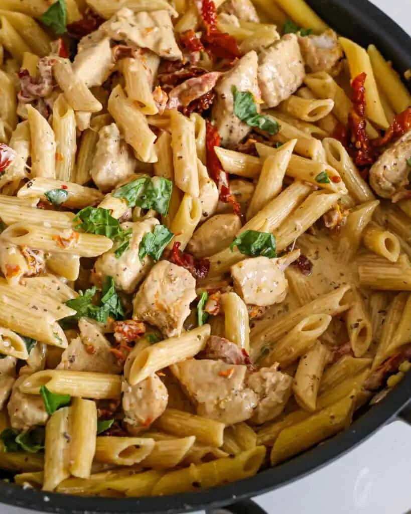 Penne pasta and chicken bites in a creamy Parmesan sauce with sundried tomatoes and torn fresh basil. 