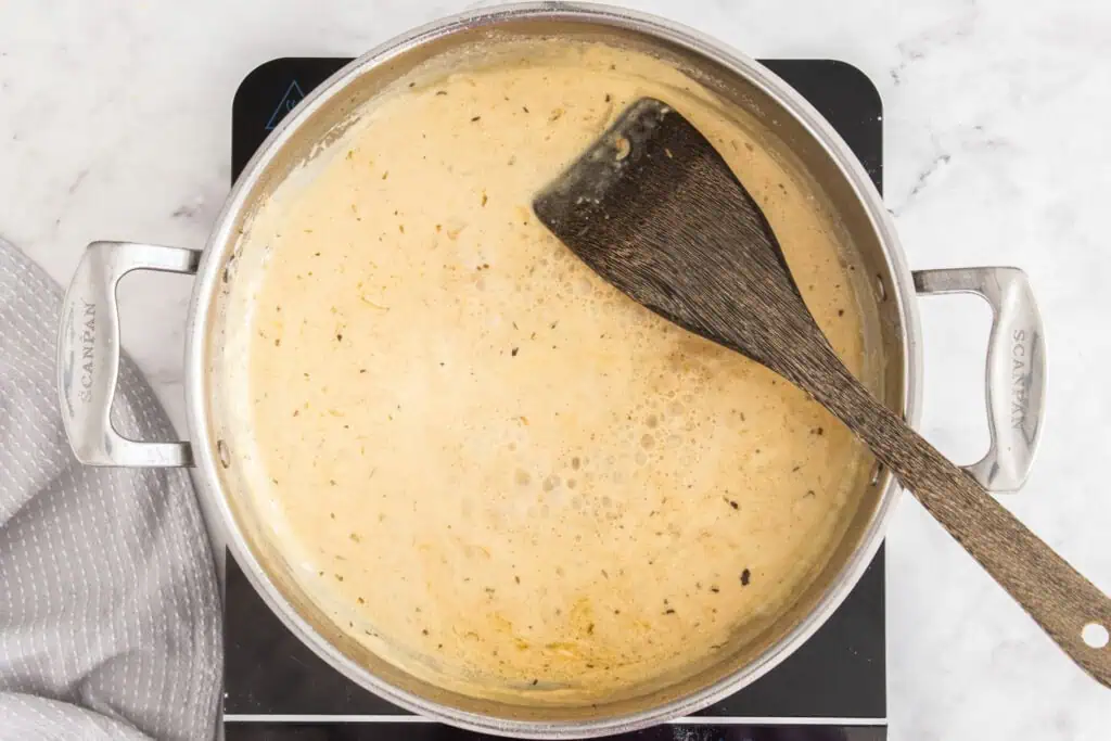 Some of the steps for making chicken florentine. Add the white wine, chicken broth, Italian seasoning, and heavy cream. Bring the mixture to a simmer and reduce by at least half.