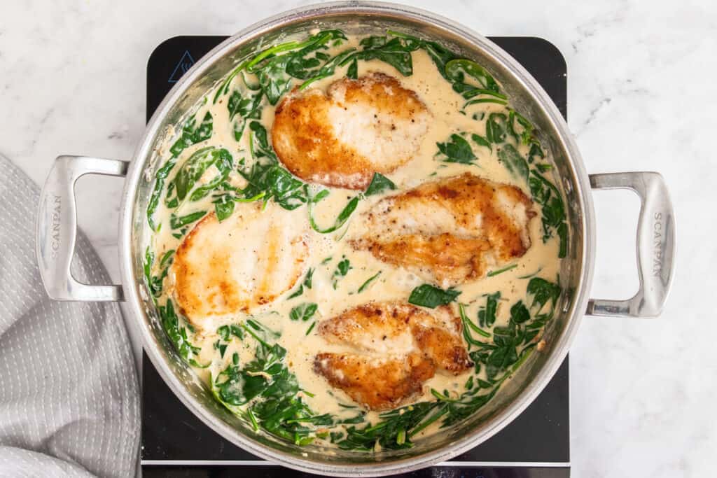 Some of the steps for making chicken florentine. Add the spinach and cook just until wilted. Add the chicken back to the pan and warm it. 