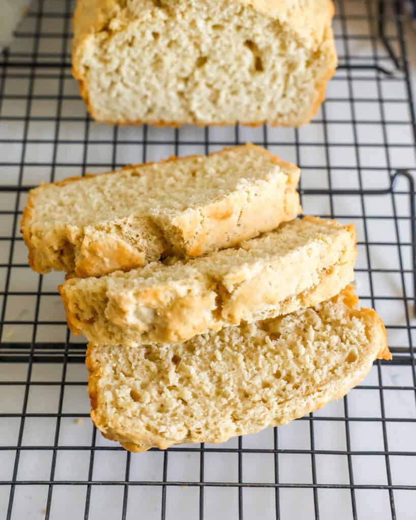 Sliced beer bread on a wire cooling rack. 
