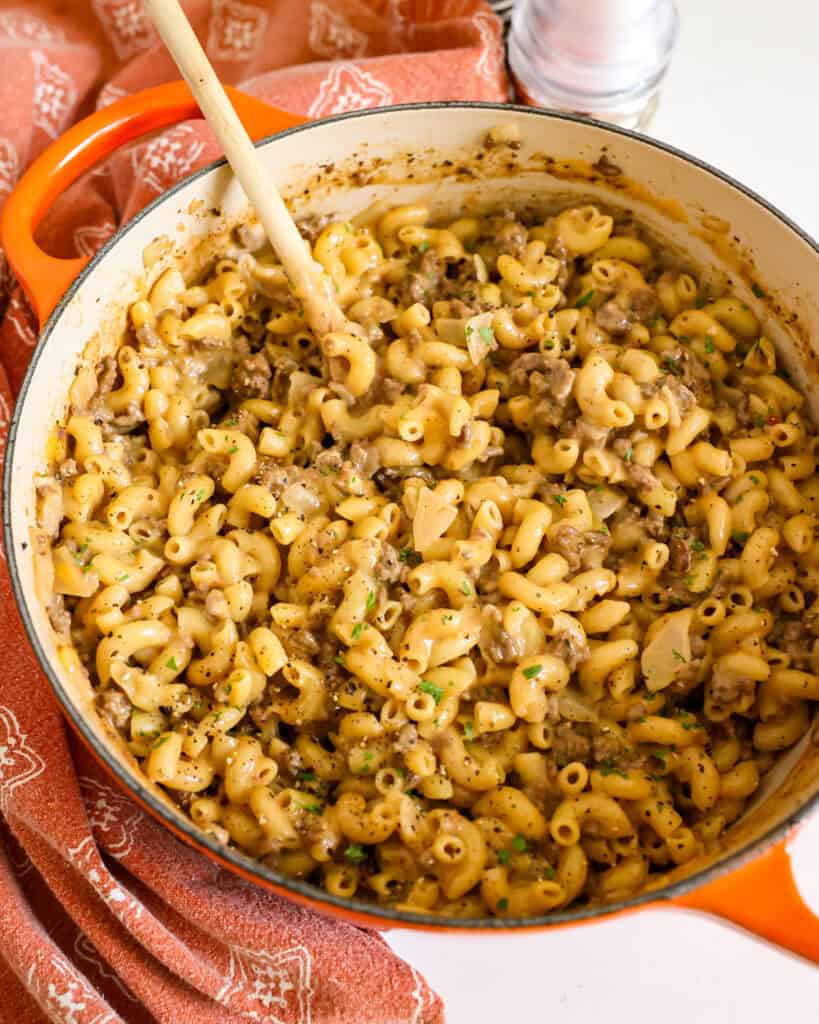 A large Dutch oven full of cheeseburger macaroni.
