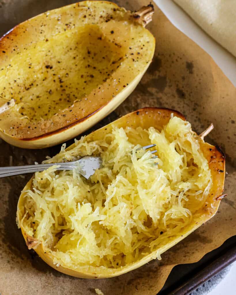 Once cool enough to handle, use a fork to pull the strands of squash from the sides and the bottom. 
