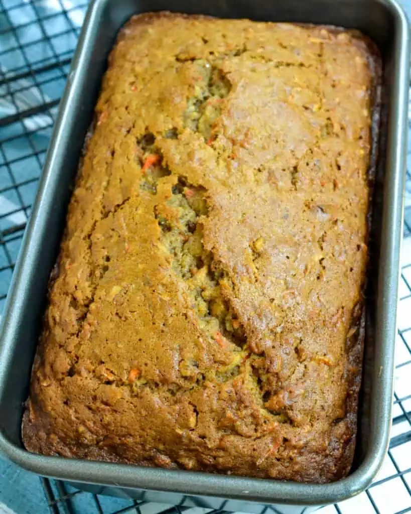 An overhead view of carrot cake bread in a loaf pan.