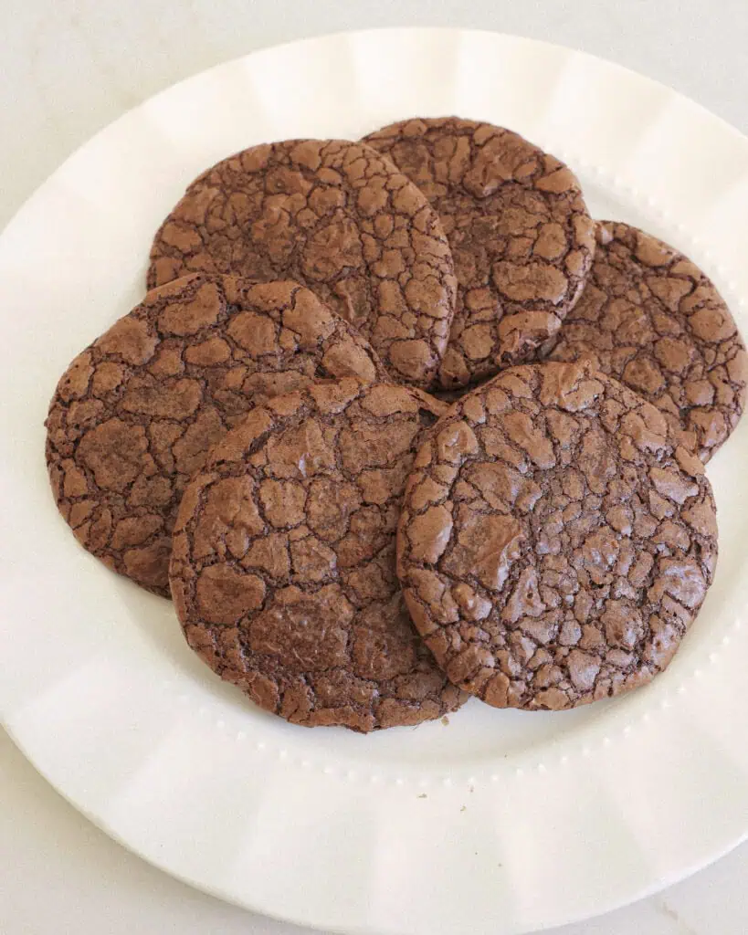A white serving plate with brownie cookies.