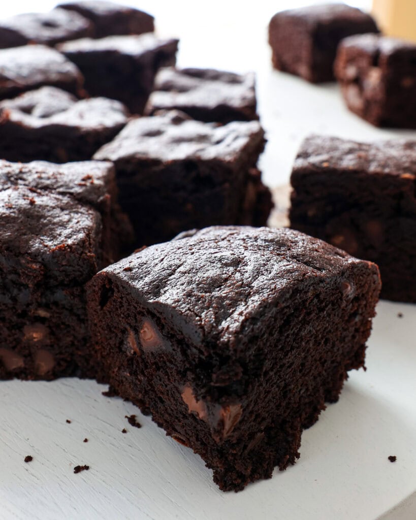 A close up view of banana brownies on a serving board. 