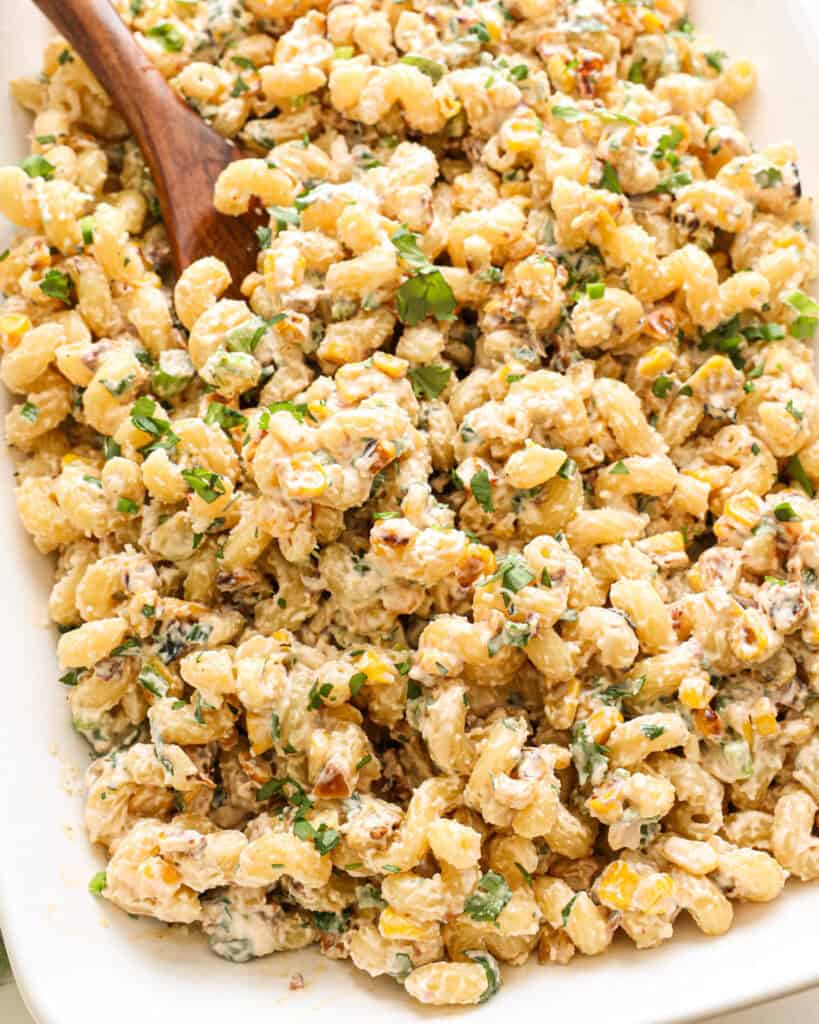 A close up view of street corn pasta salad. 