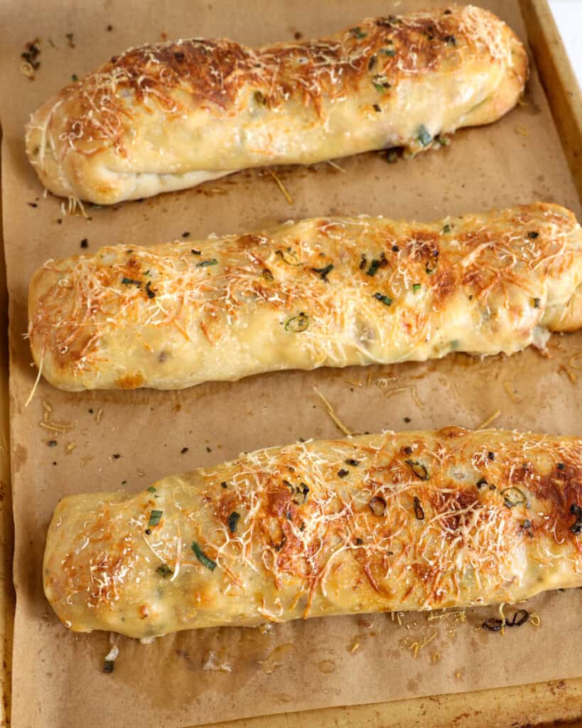 Freshly baked Costco chicken bake on a parchment covered baking sheet. 