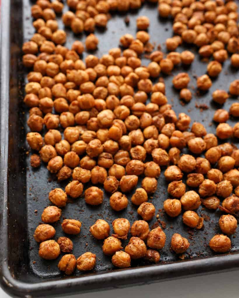 Roasted chickpeas on a baking sheet. 