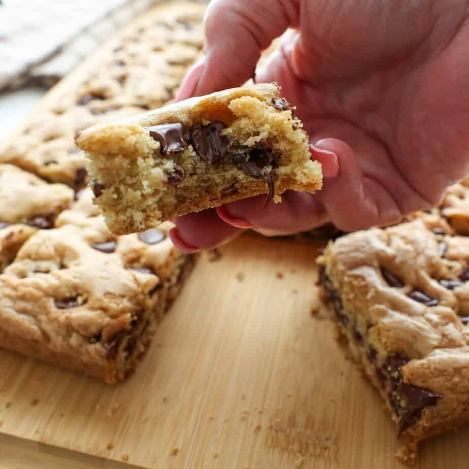 Chocolate Chip Cookie bars sliced on a cutting board