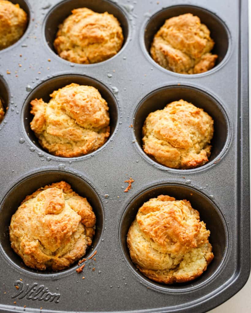 Baked sour cream biscuits in a muffin tin. 