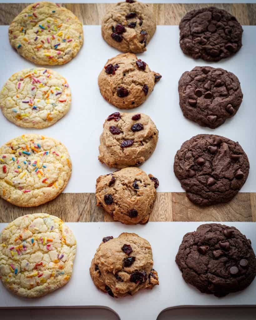 Cake mix cookies in rows on a wooden serving platter.