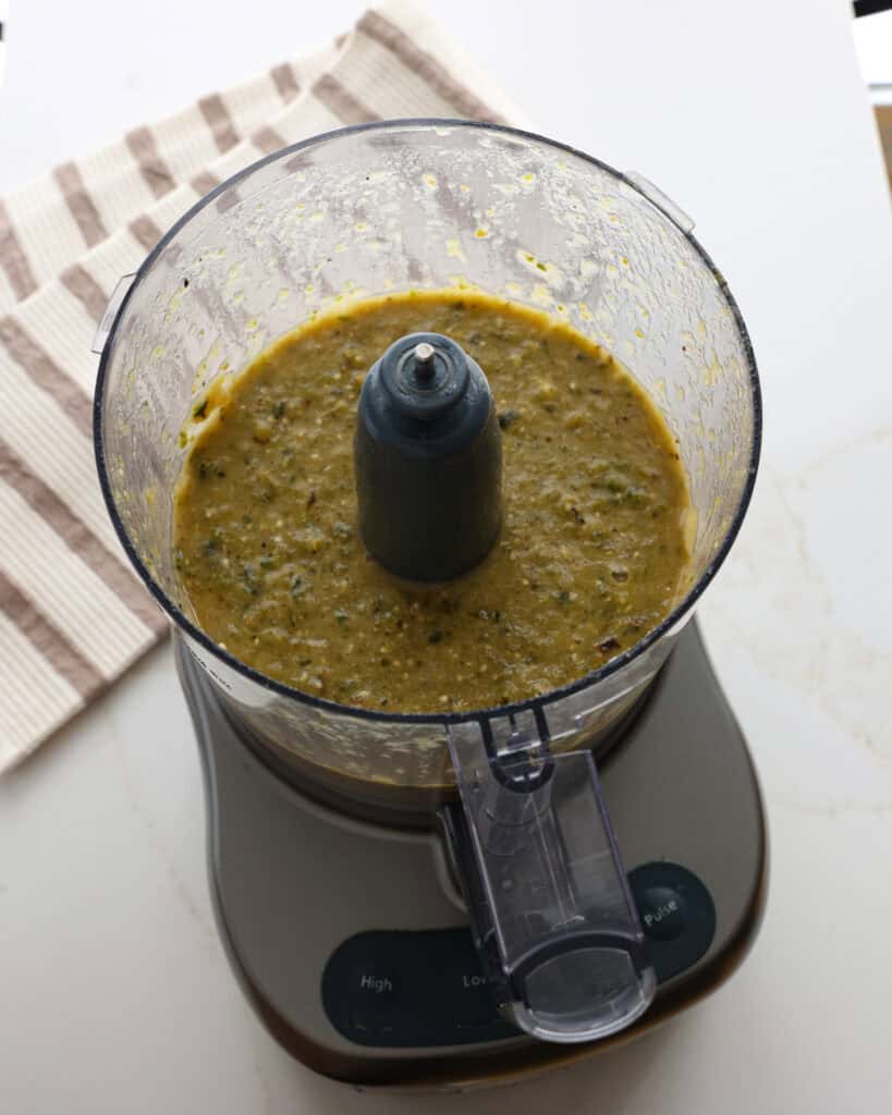 Green enchilada sauce in a food processor.