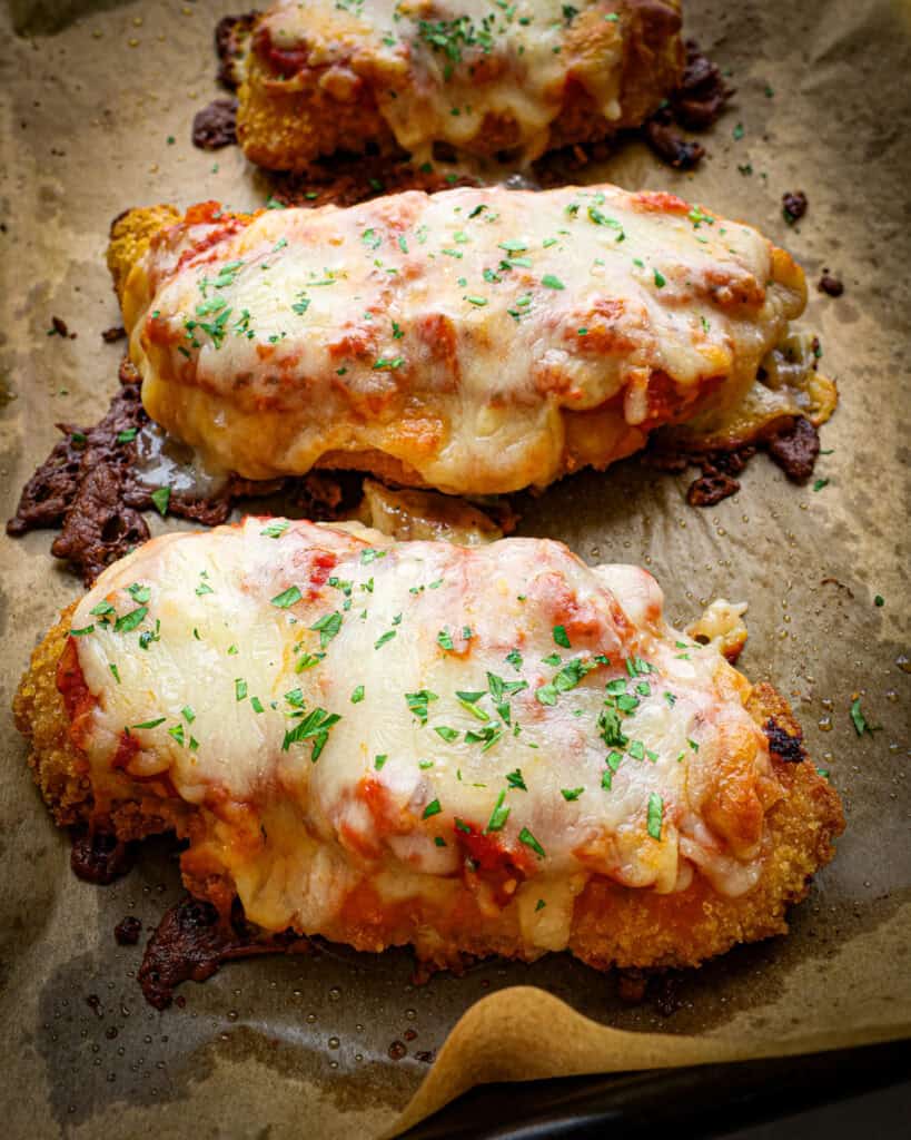 Chicken parmesan covered in homemade marinara and mozzarella cheese.