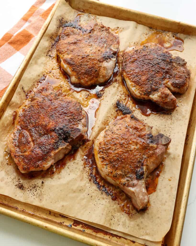 Baked pork chops seasoned with pork chop seasoning. 