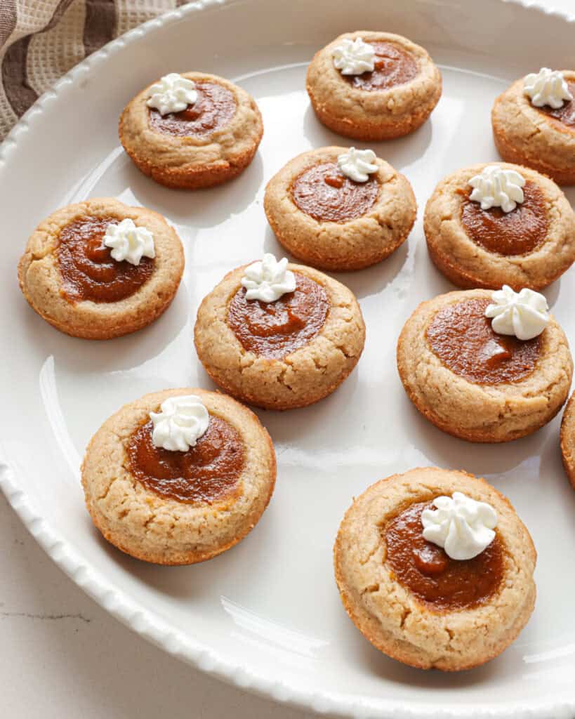 A round white tray full of pumpkin pie cookies.