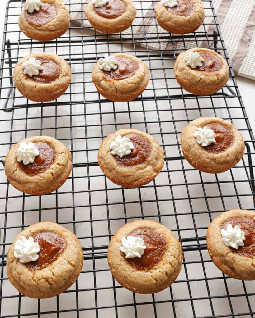 A wire rack full of pumpkin pie cookies.